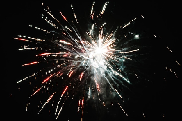 Fireworks in Happy New Year 2020. Holiday festival celebration. Fireworks display on dark sky background.