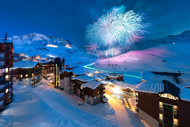 Fireworks and panorama of famous val thorens in french alps by night