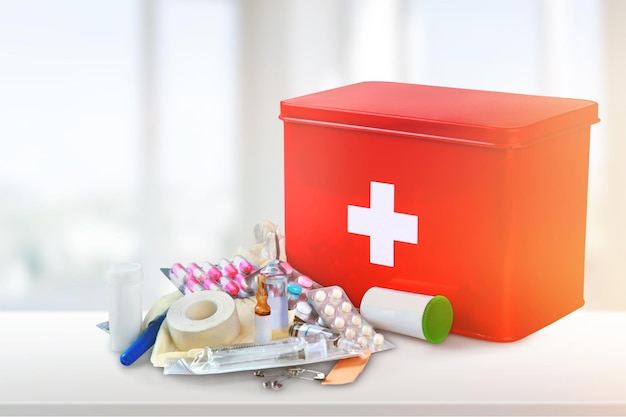 First aid kit with medical supplies on