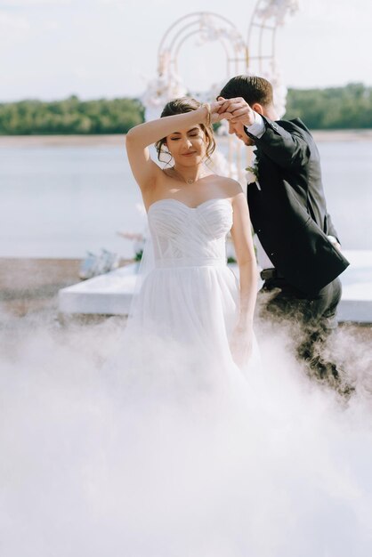 the first dance of the bride and groom inside a restaurant