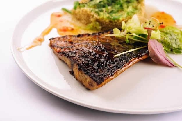 Fish dish fried fish fillet and vegetables