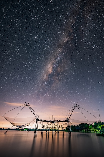 Fish nets with milky way in pakpra phatthalung thailand