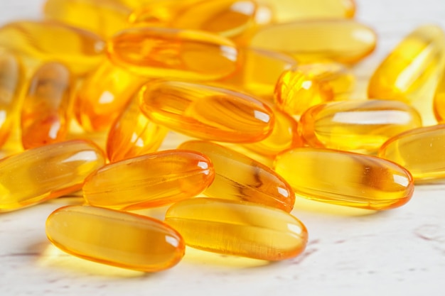 Fish oil or Cod liver oil gel in capsules with omega 3 vitamins supplementary healthy food