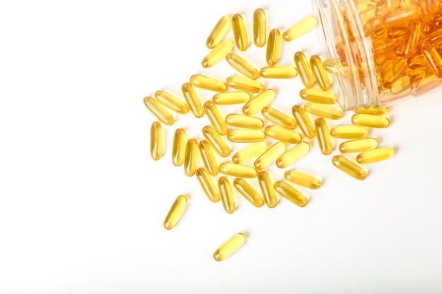 Fish oil in gelatin capsules isolate omega vitamins in golden colored pills