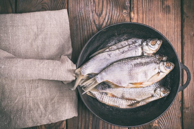 Fish ram in a round black cast-iron frying pan