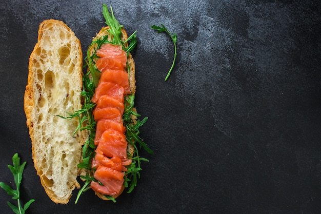 fish sandwich and greens