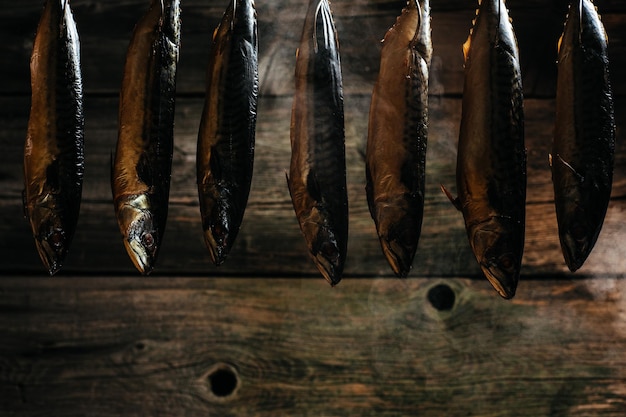 Fish Smoking Process For Home Use fish hanging side by side in a smoker Smoked Mackerel Smoking Process Fish In Smokehouse