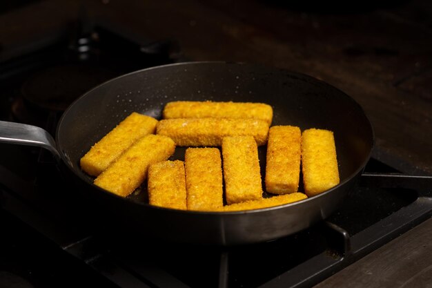 Fish sticks in a pan Preparation of frozen fish sticks Fast food