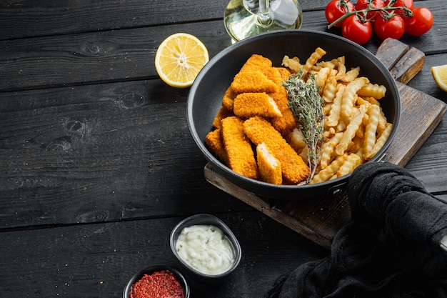 Fish Sticks with vegetables set on frying iron pan