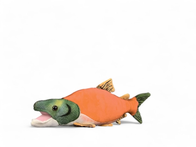 A fish stuffed animal that has orange color isolated on white