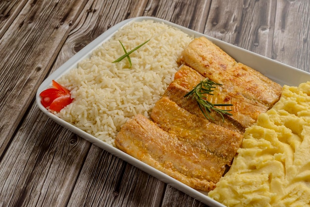 Fish Tilapia fillet with white rice and mashed potatoes