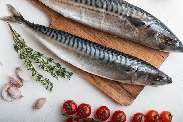 Fish on white textured table.