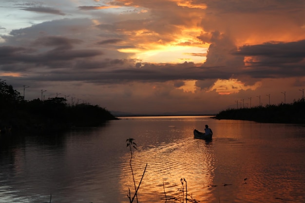 Fisherman on His Boat at Sunset. Fishermen Boat at Sunset