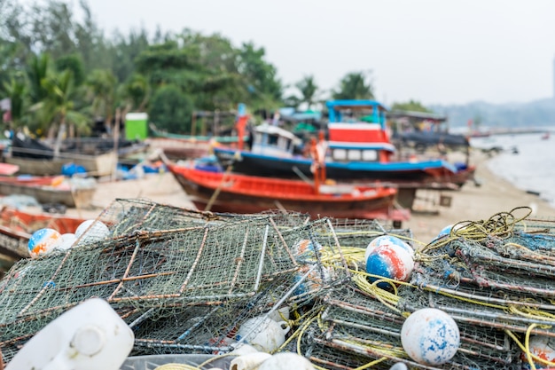 Fisherman's crab catching equipment in the pier stacked and prepared for working.