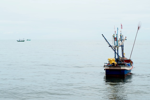 Fisherman in Small Boat in the Sea      