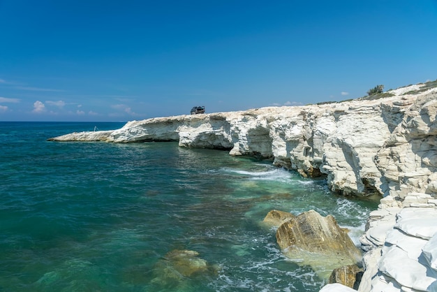 Fishermen are fishing on the seashore Coast of white stones