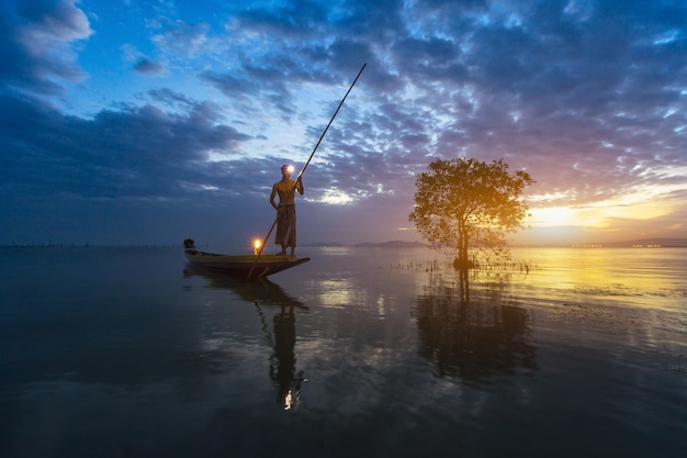 Fishermen are using fishing tools in the morning along the Songkhla Lake.