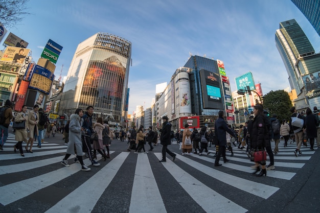 Fisheye scene of Undefined People and car Crowd are walking on pedestrains intersection