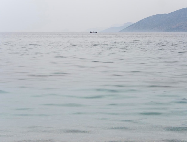 Fishing boat in the Corinthian Gulf of the Ionian sea in Greece on a cloudy day in Greece