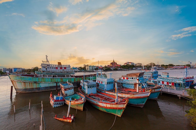 fishing boats and beautiful sky,Many boats moored in sunrise morning time at Chalong port,