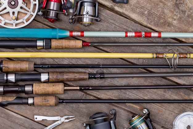 Photo fishing rods and reels on wooden boards