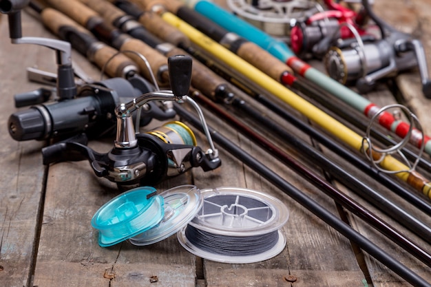 Photo fishing rods and reels on wooden boards