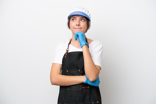 Fishmonger woman wearing an apron having doubts and thinking