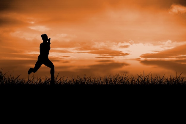 Fit brunette running and jumping against a couldy day