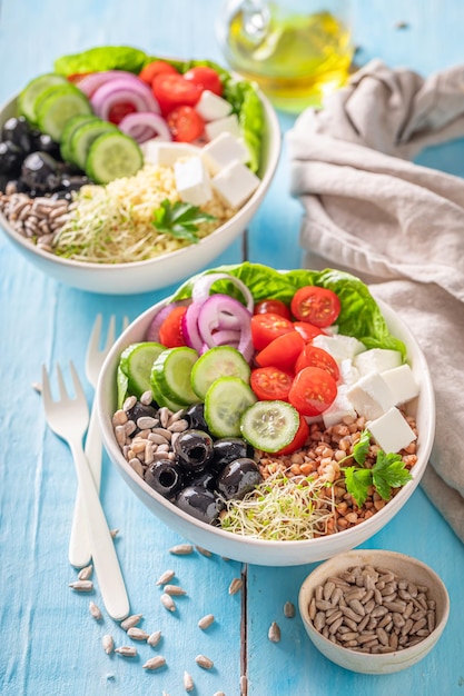 Fit Greek salad with vegetables cheese and buckwheat groats