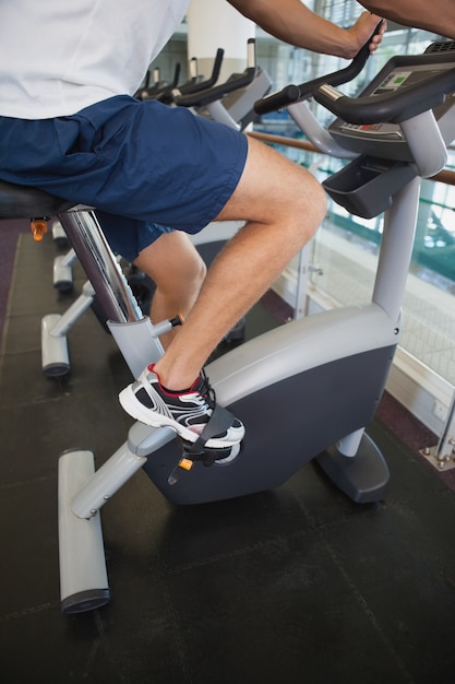 Fit man working out on the exercise bike