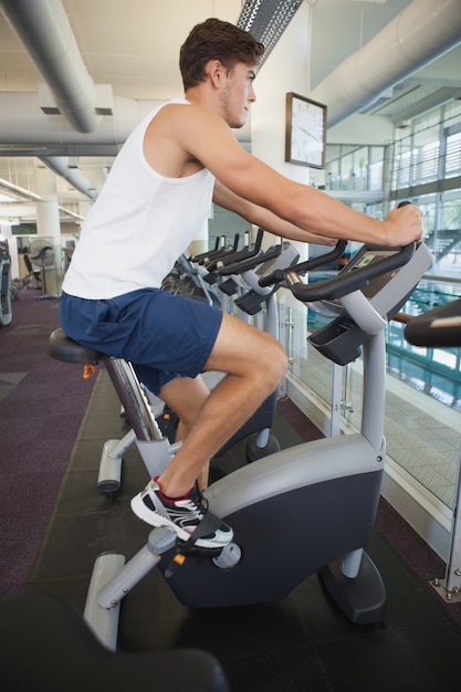 Fit man working out on the exercise bike