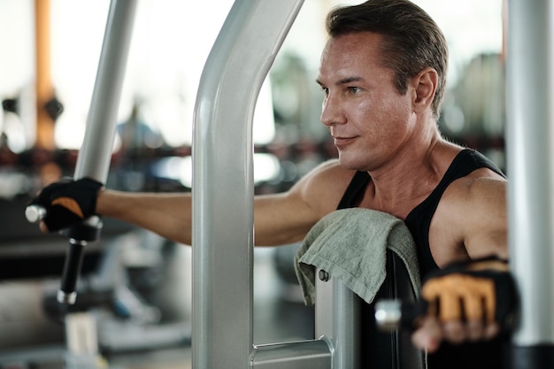 Fit Man Working out in Gym