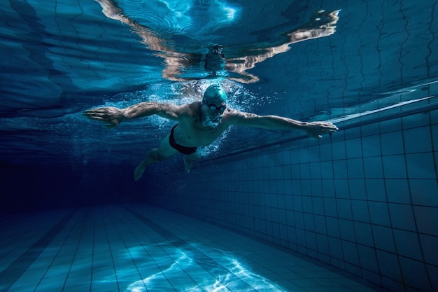 Fit swimmer training by himself