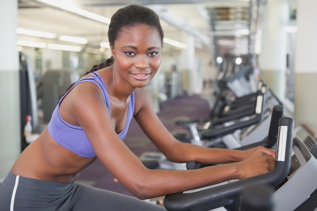 Fit woman working out on the exercise bike