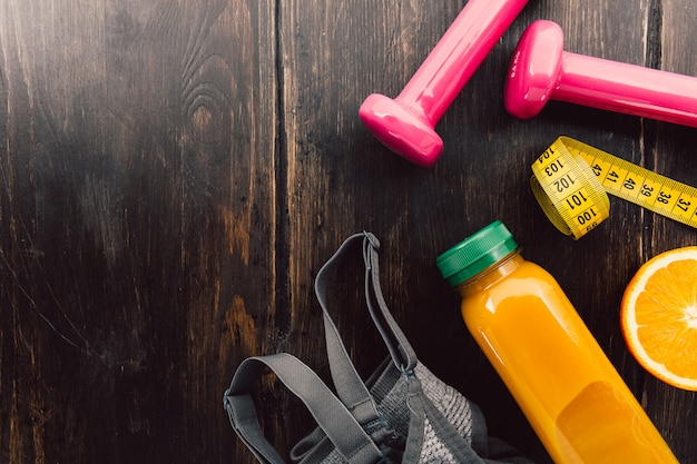 Fitness equipment on wooden table 