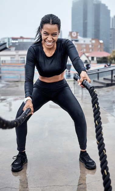 Fitness exercise and black woman with rope in city for cardio workout training and sports wellness Motivation focus and portrait of female athlete with gear for strong muscles power and energy