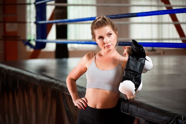 Fitness female getting ready for boxing practice.