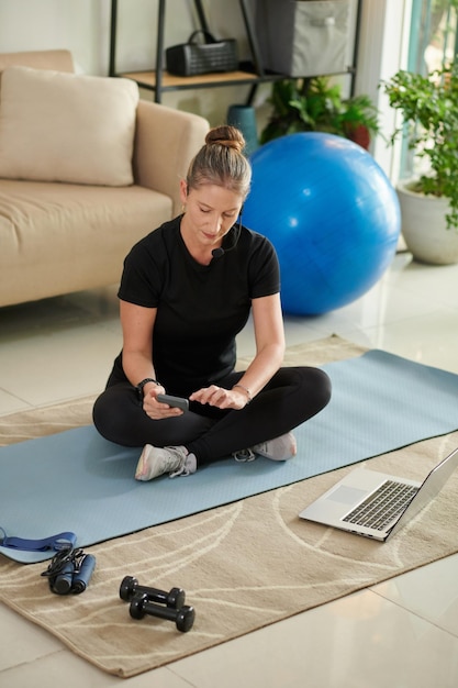 Fitness Instructor Checking Social Media