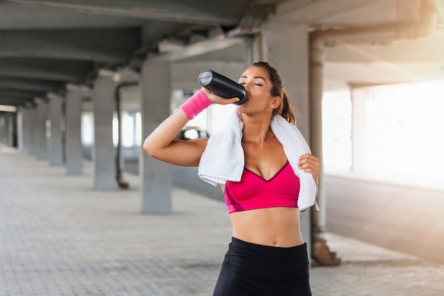 Fitness model working out on the street