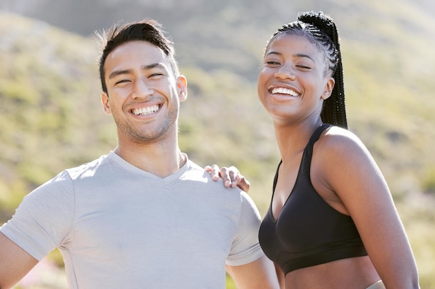 Fitness nature and couple happy to workout in outdoor adventure trail Sports exercise and man and black woman train in sun together Wellness health and runner and personal trainer smile in park