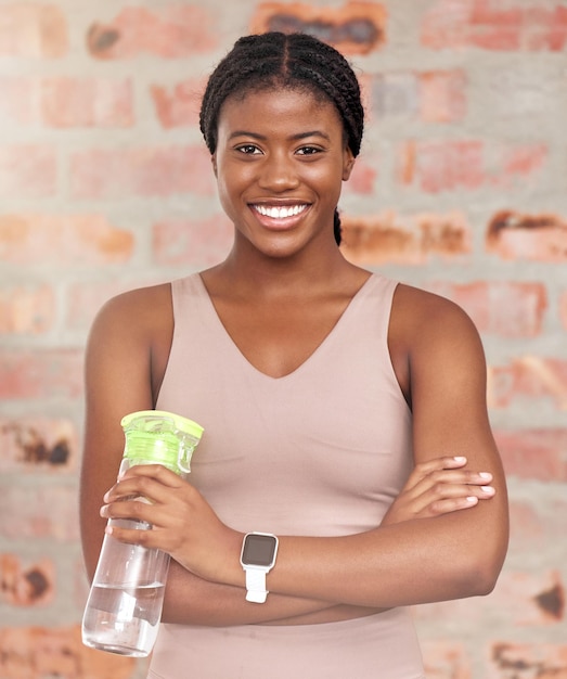 Fitness portrait or black woman with water bottle to start training routine cardio exercise or workout Happy face gym or healthy sports girl ready for for body goals target or challenge in Kenya