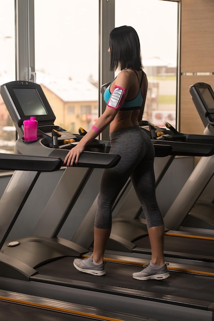 Fitness Woman Exercising On A Treadmill