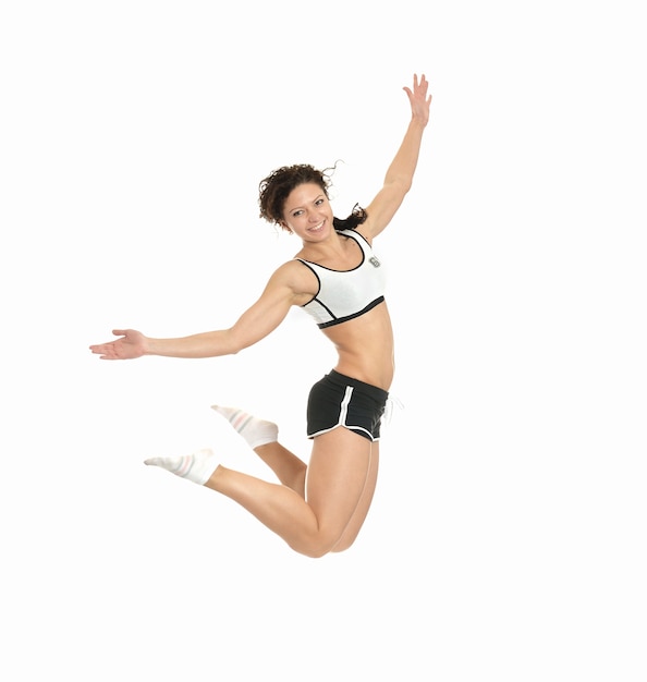 Fitness woman jumping isolated on white background