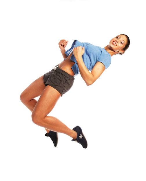 Fitness woman jumping of joy