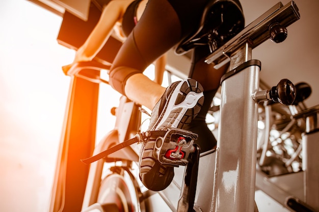 Fitness woman working out on exercise bike at the gym.exercising concept.fitness and healthy lifestyle