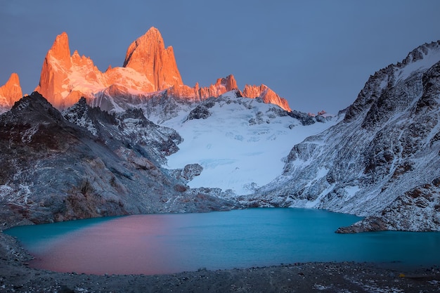 Fitzroys red burning peak and lake  at sunrise in Los Glaciares National Park Patagonia Argentina