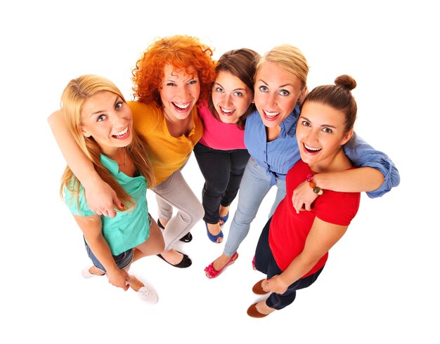 five beautiful girls standing and smiling over white