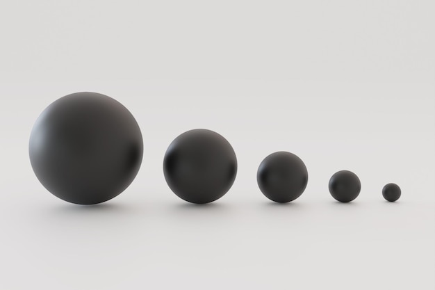 Five black balls of different sizes. balls of different sizes on a white background.