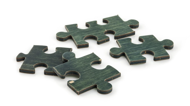 Five green puzzle pieces with a distinct wood texture isolated on a white background