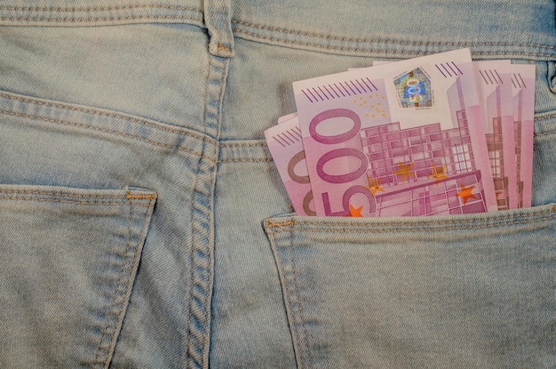 Five hundred euro bills in the back pocket of jeans.